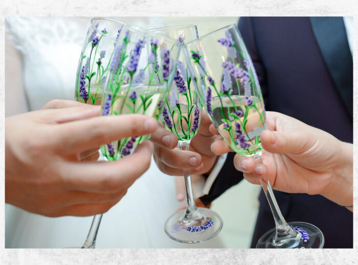 flowers painted on glasses for wedding, for an event. colorful painted champagne event glasses