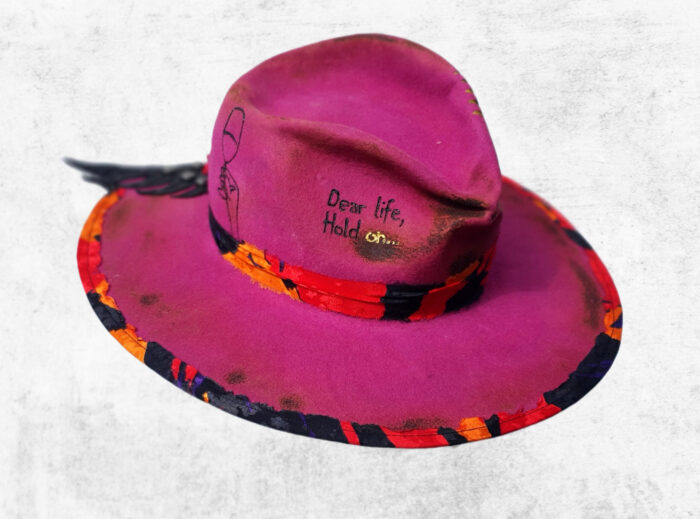 pink felt hat with wine drawings and burnt details croco leather wings detail