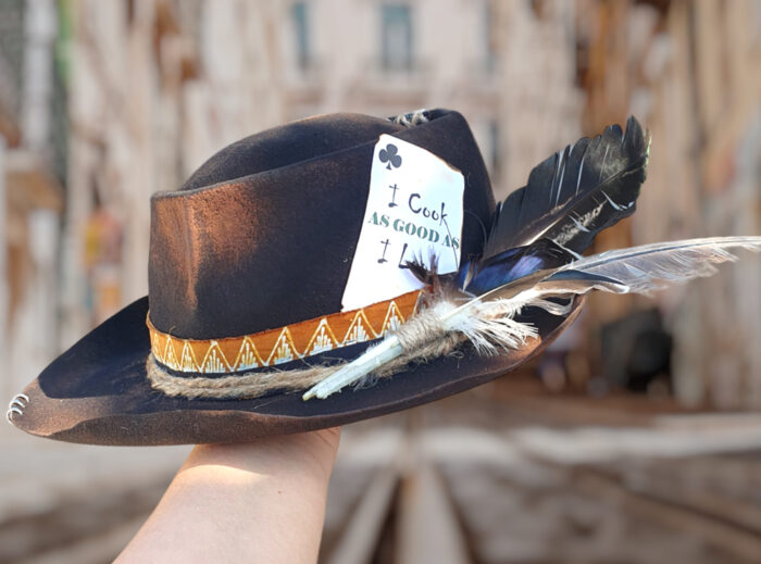 Black burnt natural felt hat with custom message and feaders