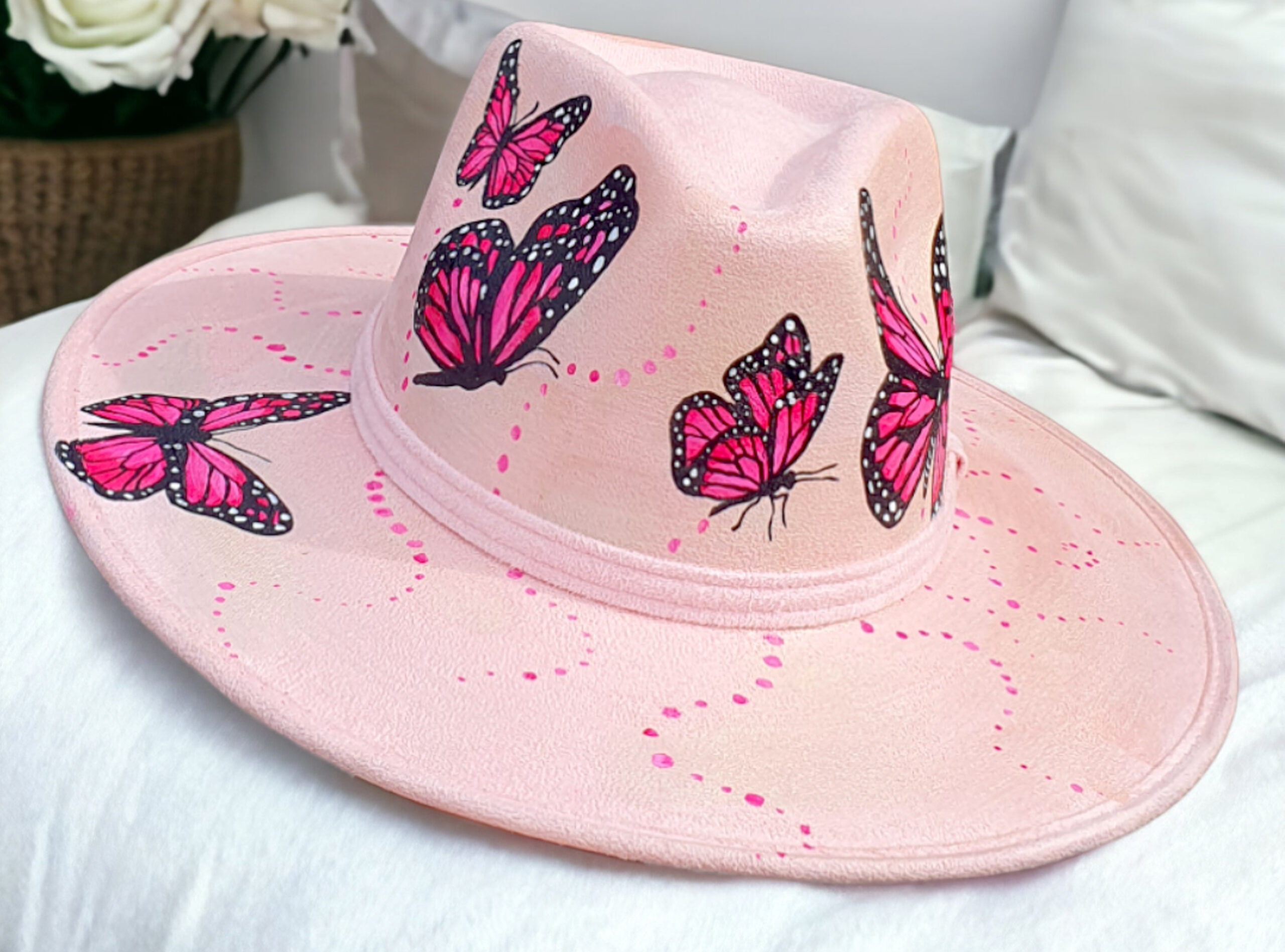handmade hat painted with pink butterflies and camelon details