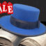 electric blue felt hat canotire with black decor on the crown