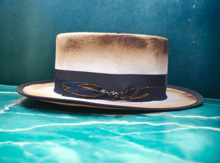 white burnt canotier hat with black and blue crown decor