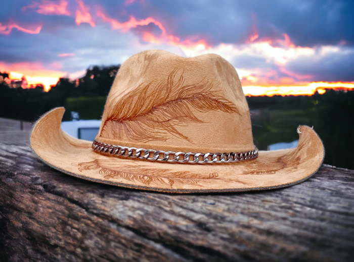 feathers engraved on a beige western hat