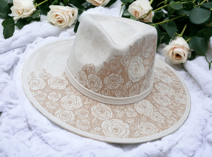 white suede hat engraved with rosses