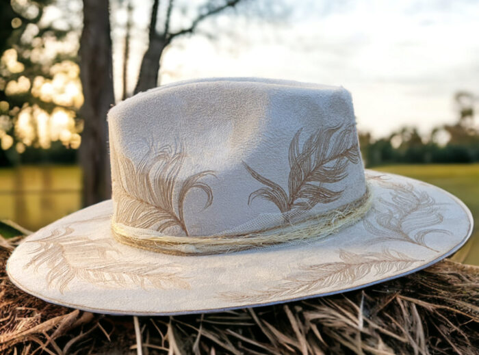 white suede tattoo hat with feathers