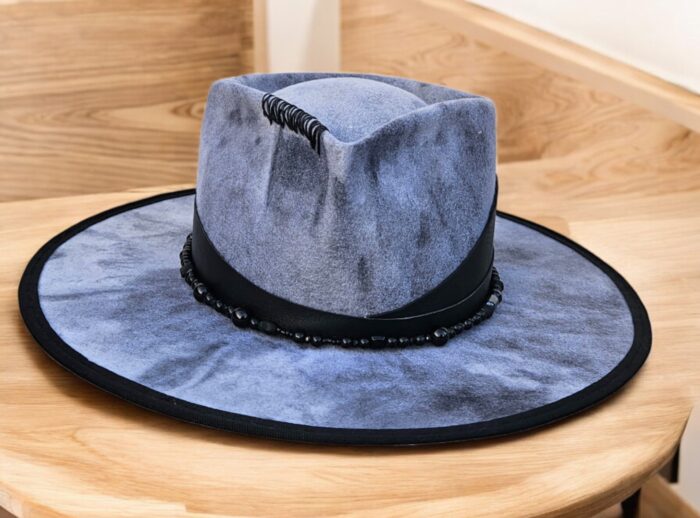 felt hat handpainted with natural leather attached on the decor, beans and stiches